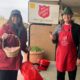 Laura Biever and Max Rumbaugh volunteer to ring Salvation Army's bells